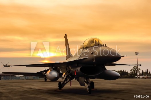 Picture of f16 falcon fighter jet on sunset background 